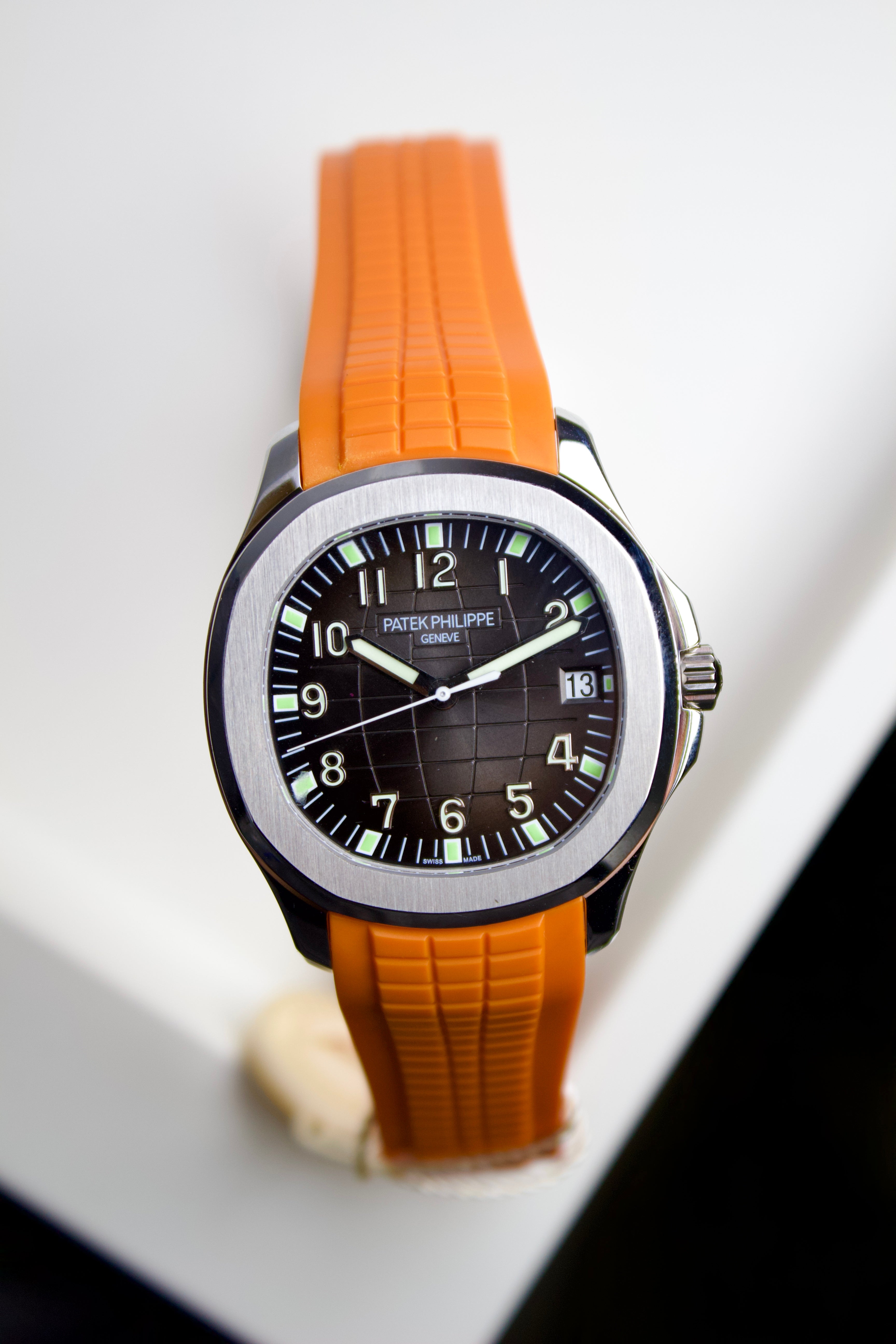PATEK PHILIPPE AQUANAUT STAINLESS STEEL BLACK DIAL WITH ORANGE STRAP